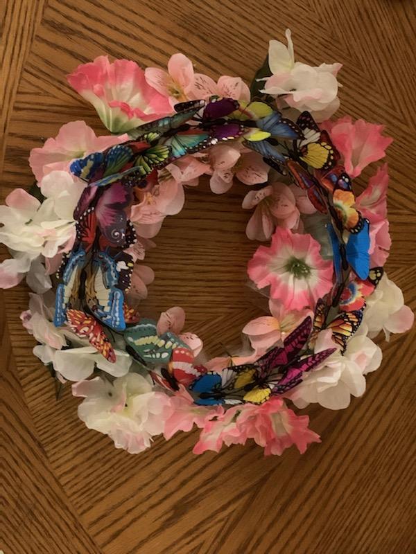 Wreath of flowers and butterflies
